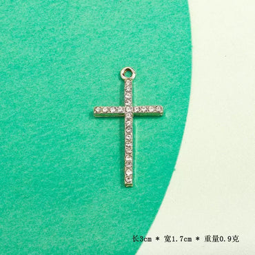 Zircon Cross Charm